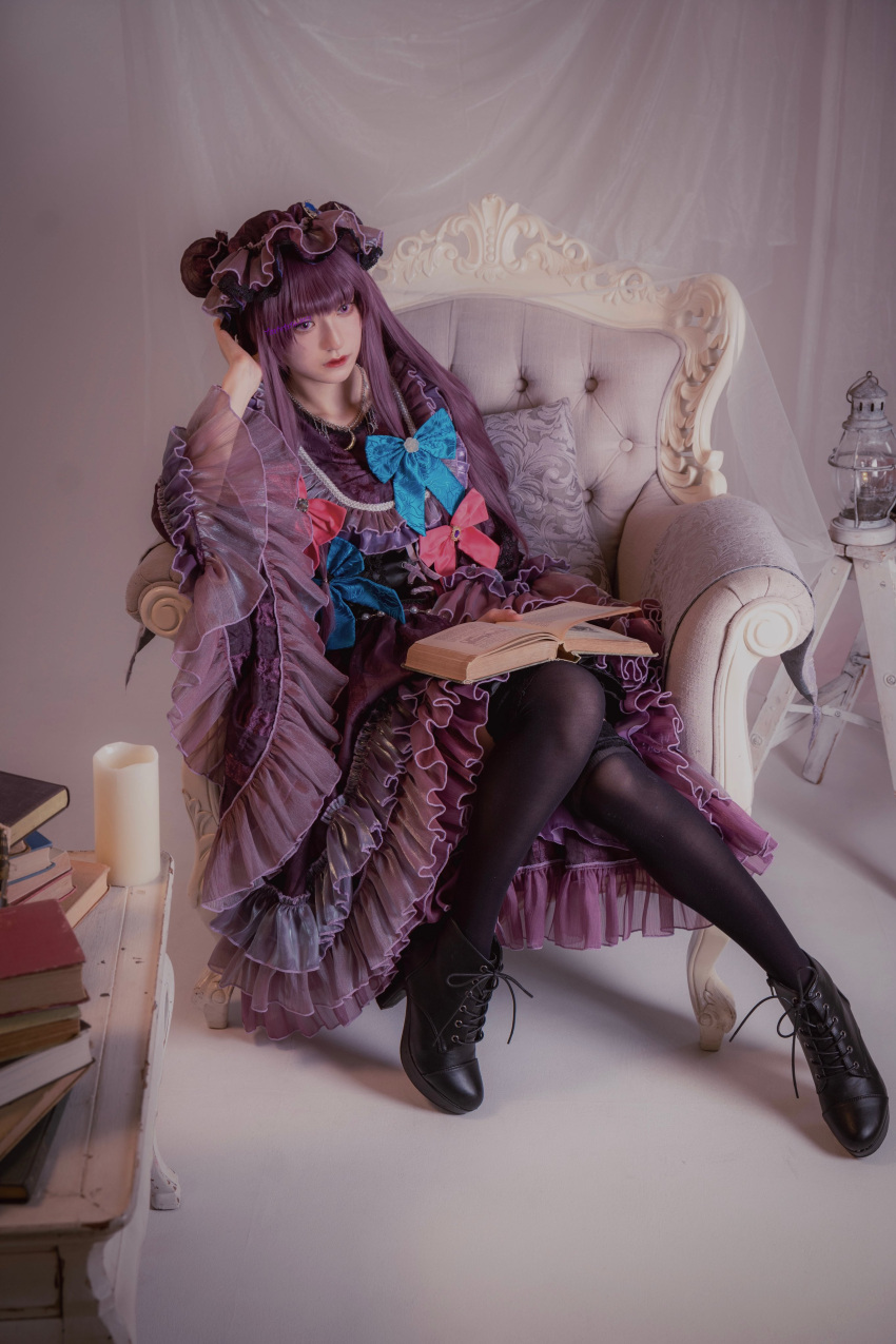 1girl absurdres armchair black_footwear blue_bow blunt_bangs book book_stack boots bow candle chair closed_mouth cosplay cosplay_photo curtains dress frills full_body hand_on_own_head hat high_heels highres holding holding_book indoors lantern long_hair long_sleeves looking_at_viewer mob_cap open_book patchouli_knowledge photo_(medium) purple_dress purple_eyes purple_hair ribbon shoelaces sitting solo striped_clothes table tartetatin0516 thighhighs touhou wide_sleeves