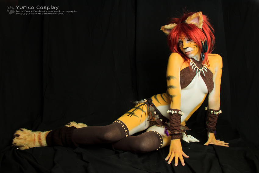 bodypaint clothed clothing cosplay ear_piercing feathers feline female hair leather mammal piercing red_hair skimpy tiger tribal_clothing yuricocosplay yurikocosplay