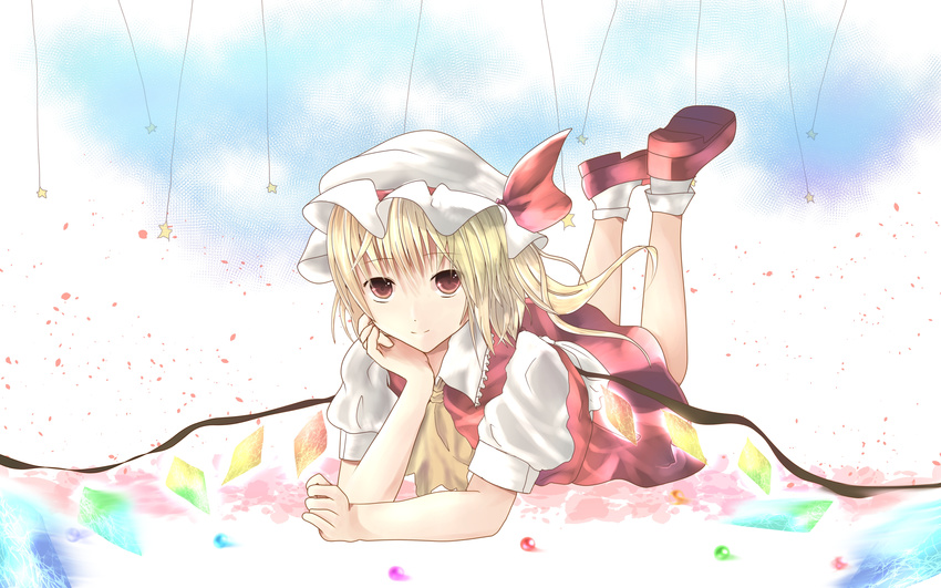 absurdres ascot bad_id bad_pixiv_id blonde_hair conesa flandre_scarlet hat hat_ribbon highres legs_up looking_at_viewer lying on_stomach petals puffy_sleeves red_eyes ribbon shirt short_sleeves side_ponytail skirt skirt_set solo star touhou wings