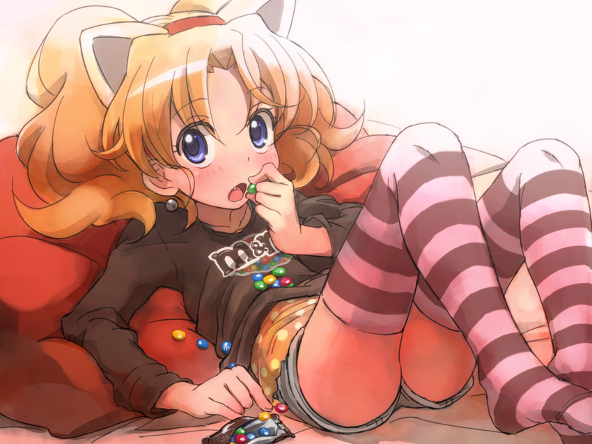 animal_ears blonde_hair blue_eyes blush candy cat_ears earrings eating fang feet_out_of_frame food jewelpet_(series) jewelpet_twinkle jewelry lying m&amp;m's miria_marigold_mackenzie no_shoes non-web_source nyama on_back open_mouth product_placement shirt shorts solo striped striped_legwear t-shirt thighhighs