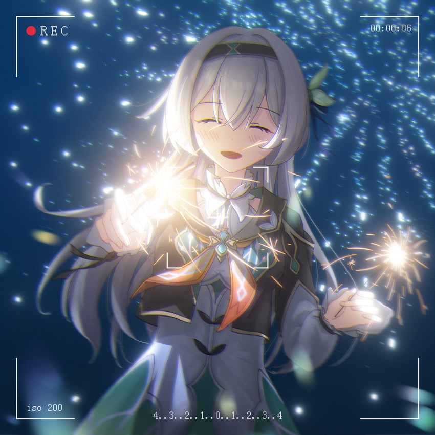 1girl black_capelet black_hairband blush capelet chinese_commentary closed_eyes commentary_request dress firefly_(honkai:_star_rail) fireworks flower green_dress hair_flower hair_ornament hairband highres holding_fireworks honkai:_star_rail honkai_(series) kokage_(chenff) long_sleeves motion_blur multicolored_clothes multicolored_dress open_mouth recording smile solo sparkler upper_body viewfinder white_dress white_hair