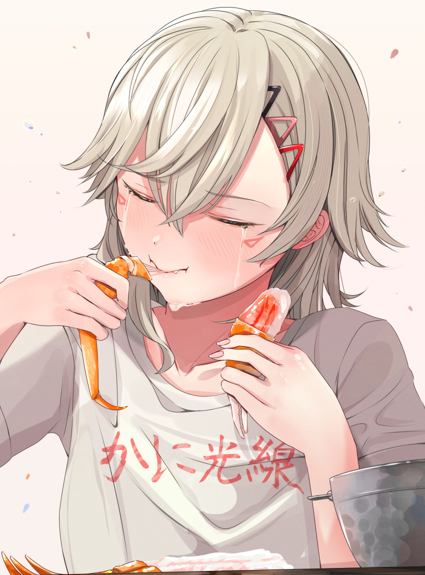 1girl blush closed_eyes clothes_writing crab crying eating facial_mark fang fang_out food grey_hair hair_ornament hairclip hatogayar highres holding holding_food komori_met long_hair shirt solo t-shirt tears translation_request virtual_youtuber vspo!