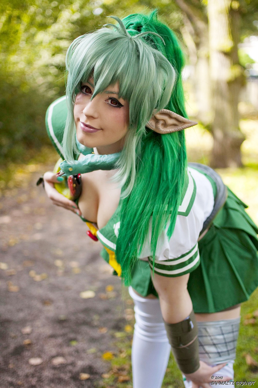1girl armor breasts cleavage cosplay echidna echidna_(cosplay) elf female green_hair green_nails highres k-a-n-a kana large_breasts nail_polish photo pointy_ears queen's_blade queen's_blade snake solo