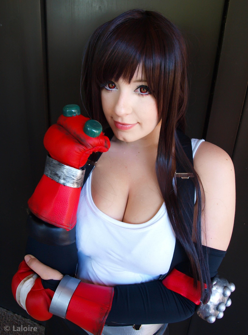 breasts cleavage cosplay final_fantasy final_fantasy_vii fingerless_gloves gloves highres k-a-n-a kana large_breasts long_hair miniskirt photo skirt square_enix suspenders tank_top tifa tifa_lockhart tifa_lockhart_(cosplay) very_long_hair