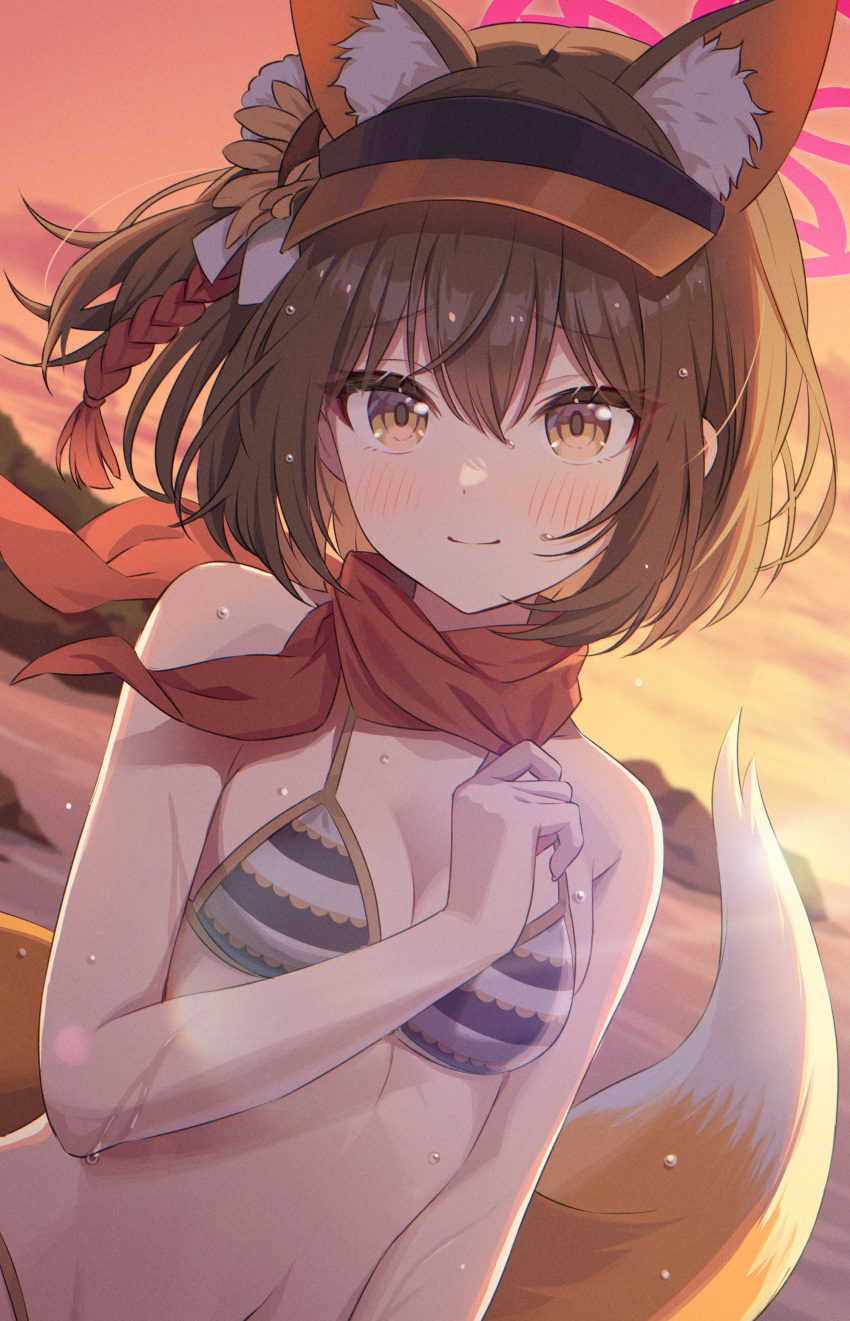 1girl absurdres animal_ear_fluff animal_ears backlighting beach bikini black_hair blue_archive blurry blush breasts cleavage commentary_request depth_of_field extra_ears eyeshadow fox_ears fox_girl fox_tail hair_between_eyes halo highres izuna_(blue_archive) izuna_(swimsuit)_(blue_archive) long_hair looking_at_viewer makeup medium_breasts momomoi_momoi mountainous_horizon navel ocean official_alternate_costume outdoors red_eyeshadow red_scarf rope scarf shimenawa short_hair sidelocks smile solo stomach striped striped_bikini swimsuit tail twilight visor_cap wet wet_clothes wet_swimsuit yellow_eyes