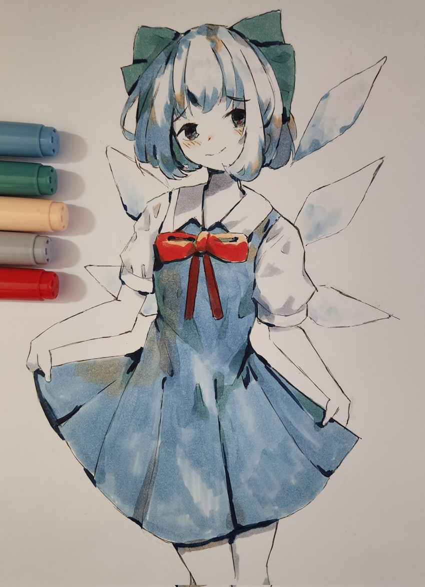 1girl art_tools_in_frame black_eyes blue_dress blue_hair blush bow bowtie cirno collared_dress cowboy_shot dress english_commentary graphite_(medium) grey_bow hair_bow highres ice ice_wings marker_(medium) multicolored_clothes multicolored_dress pen_(medium) photo_(medium) pleated_dress red_bow red_bowtie short_hair short_sleeves skirt_hold smile solo touhou traditional_media vanilla_flan white_dress wings