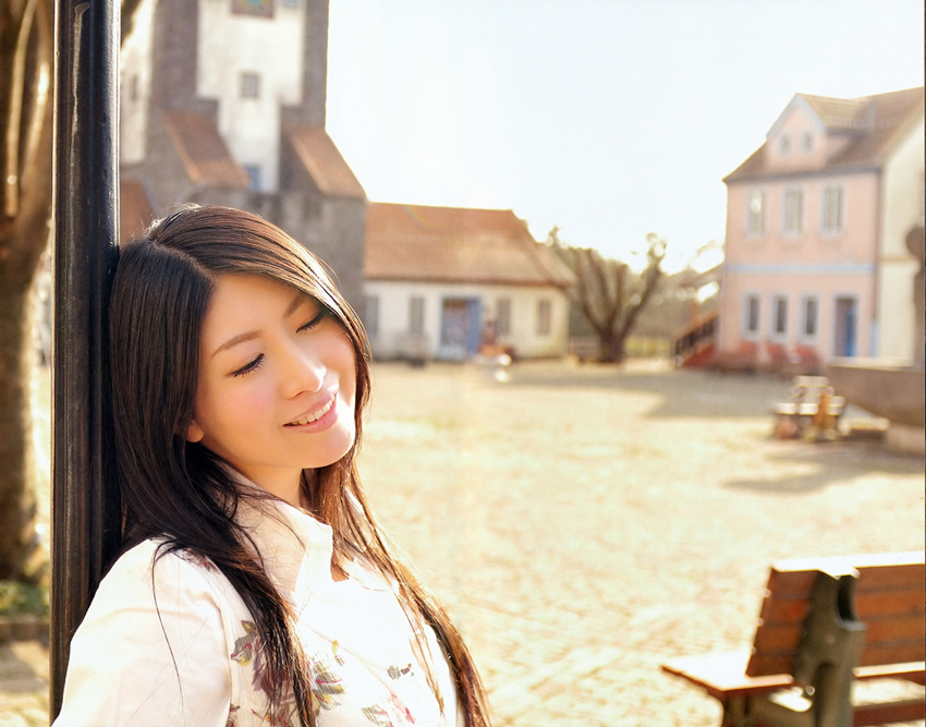 bench black_hair building chihara_minori dark_hair eyes_closed highres house leaning long_hair outdoors photo seiyuu smile teeth tree white_clothes window