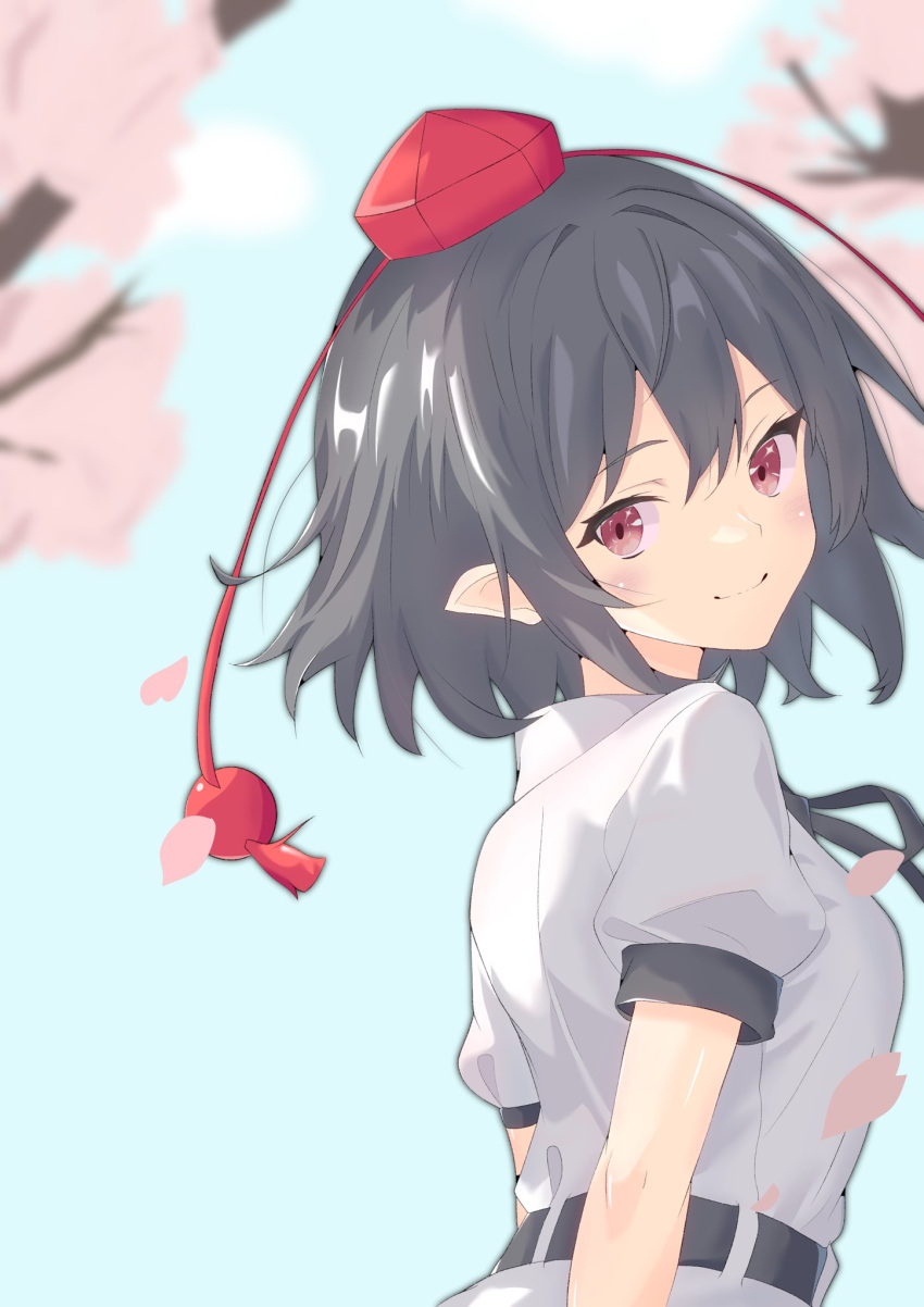 1girl black_hair blush cherry_blossoms closed_mouth commentary_request day falling_petals from_behind hair_between_eyes hat head_tilt highres kurapi_pref light_blue_background looking_at_viewer looking_back medium_hair outdoors petals pointy_ears puffy_short_sleeves puffy_sleeves red_eyes red_headwear shameimaru_aya shirt short_sleeves simple_background smile solo tokin_hat touhou tsurime upper_body white_shirt