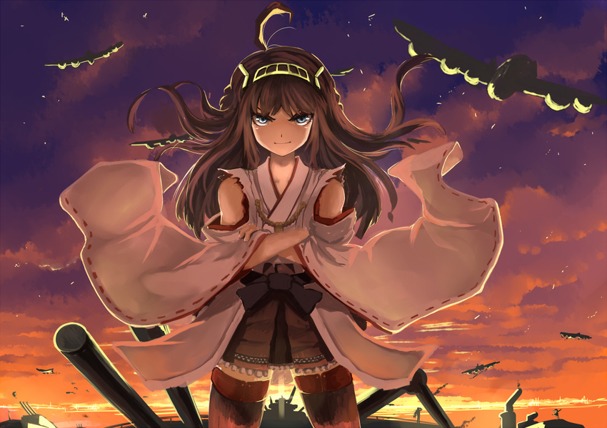 ahoge aircraft airplane bare_shoulders blue_eyes braid brown_hair crossed_arms double_bun grin gunbuster_pose headband japanese_clothes kantai_collection kongou_(kantai_collection) long_hair mecha_musume nontraditional_miko pleated_skirt rikkido skirt smile solo sunset thighhighs wide_sleeves