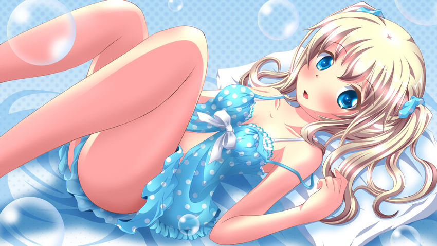 babydoll blonde_hair blue_background blue_eyes blush bow bra bubble collarbone commentary highres legs_up looking_at_viewer lying midriff neats off_shoulder on_back open_mouth original pillow polka_dot polka_dot_scrunchie scrunchie shirt short_sleeves solo strap_slip twintails underwear white_bra