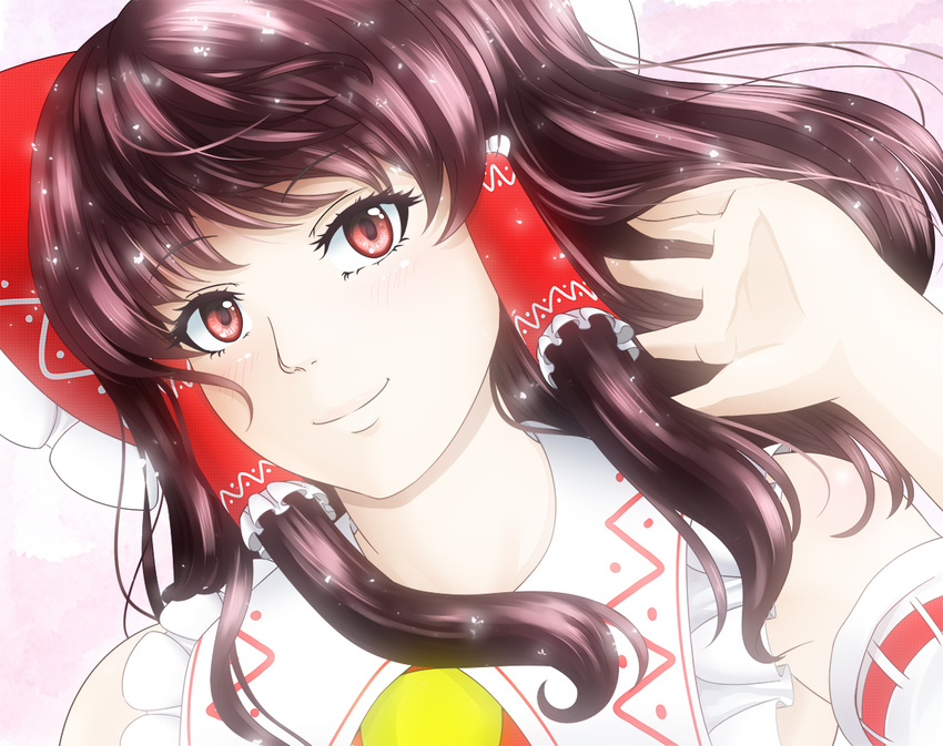 ascot blush bow brown_hair closed_mouth detached_sleeves face frilled_bow frills hair_bow hair_tubes hakurei_reimu hand_in_hair head_tilt light long_hair looking_at_viewer ototarou pink_background red_eyes ribbon-trimmed_sleeves ribbon_trim shiny shiny_hair sideways_glance smile solo sparkle touhou