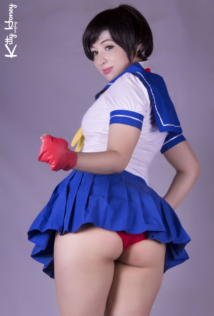 1girl absurdres asian ass capcom cosplay female fingerless_gloves from_behind gloves highres kasugano_sakura kasugano_sakura_(cosplay) looking_back miniskirt panties pantyshot photo purple_background school_uniform serafuku short_hair skirt smile solo street_fighter street_fighter_iv street_fighter_zero street_fighter_zero_2 street_fighter_zero_3 super_street_fighter_iv underwear upskirt wedgie