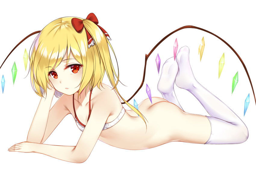 ass bangs bare_arms bare_shoulders blonde_hair bottomless bow bra collarbone commentary_request crystal eyebrows_visible_through_hair feet flan_(seeyouflan) flandre_scarlet flat_chest hair_bow hand_up highres ke-ta_(style) long_hair looking_at_viewer lying no_hat no_headwear no_shoes on_stomach one_side_up red_bow red_eyes simple_background solo thighhighs thighs touhou underwear white_background white_bra white_legwear wings
