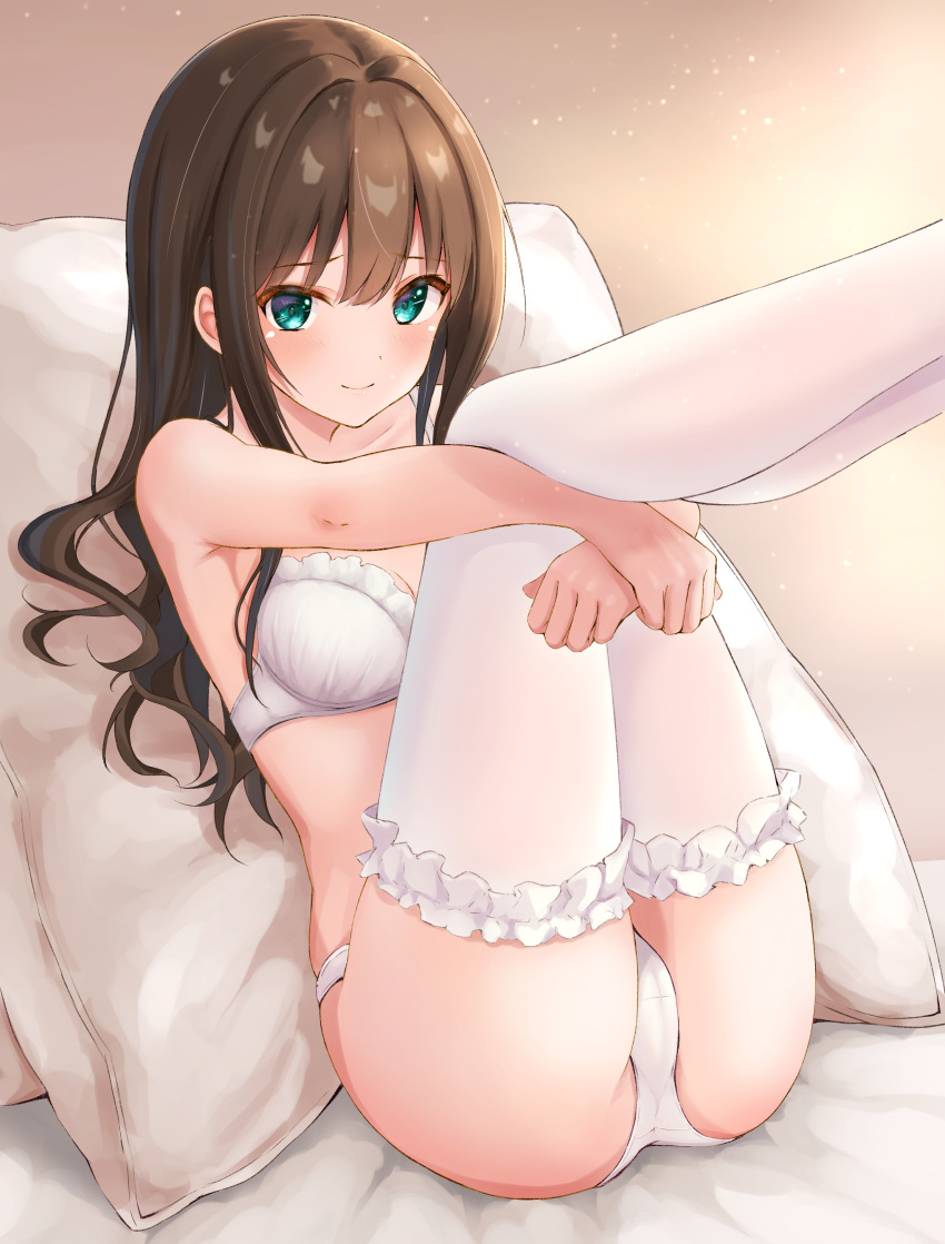 1girl absurdres black_hair blush bra breasts brown_hair ca_paria frilled_thighhighs frills green_eyes highres hugging_own_legs idolmaster idolmaster_cinderella_girls legs_up long_hair looking_at_viewer medium_breasts on_bed pantyhose pillow shibuya_rin smile solo thighhighs underwear underwear_only white_bra white_pantyhose white_thighhighs