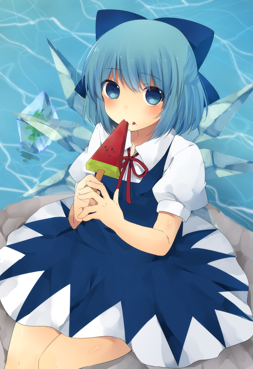 ari_suzushi bad_id bad_pixiv_id blue_dress blue_eyes blue_hair bow cirno dress eating food food_on_face frog frozen frozen_frog hair_bow highres ice ice_wings looking_at_viewer popsicle puffy_sleeves rock shirt short_sleeves sitting_on_rock solo touhou water watermelon_bar wings