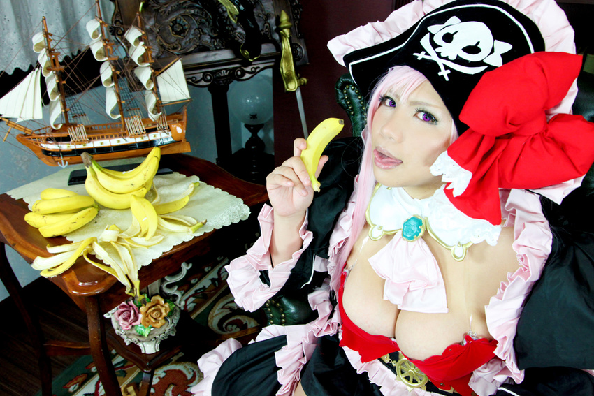 1girl banana breasts captain_liliana captain_liliana_(cosplay) chouzuki_maryou cosplay food fruit hat large_breasts lost_worlds photo pink_hair pirate pirate_hat plump purple_eyes queen's_blade queen's_blade queen's_blade_rebellion sexually_suggestive