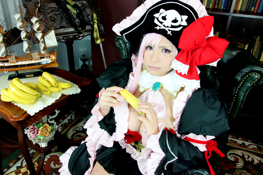 1girl banana breasts captain_liliana captain_liliana_(cosplay) chouzuki_maryou cosplay food fruit hat large_breasts lost_worlds photo pink_hair pirate pirate_hat plump purple_eyes queen's_blade queen's_blade queen's_blade_rebellion sexually_suggestive
