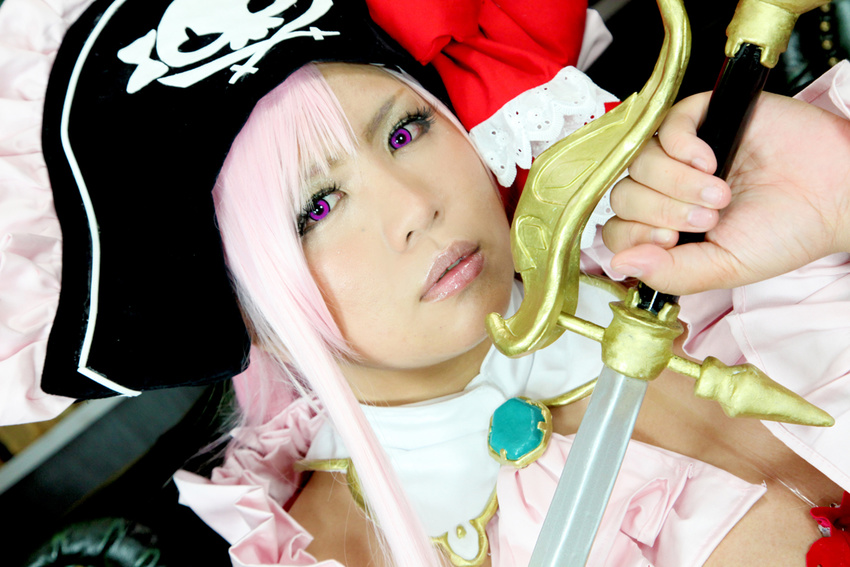 1girl breasts captain_liliana captain_liliana_(cosplay) chouzuki_maryou cosplay hat large_breasts photo pink_hair pirate pirate_hat plump purple_eyes queen's_blade queen's_blade queen's_blade_rebellion sword weapon