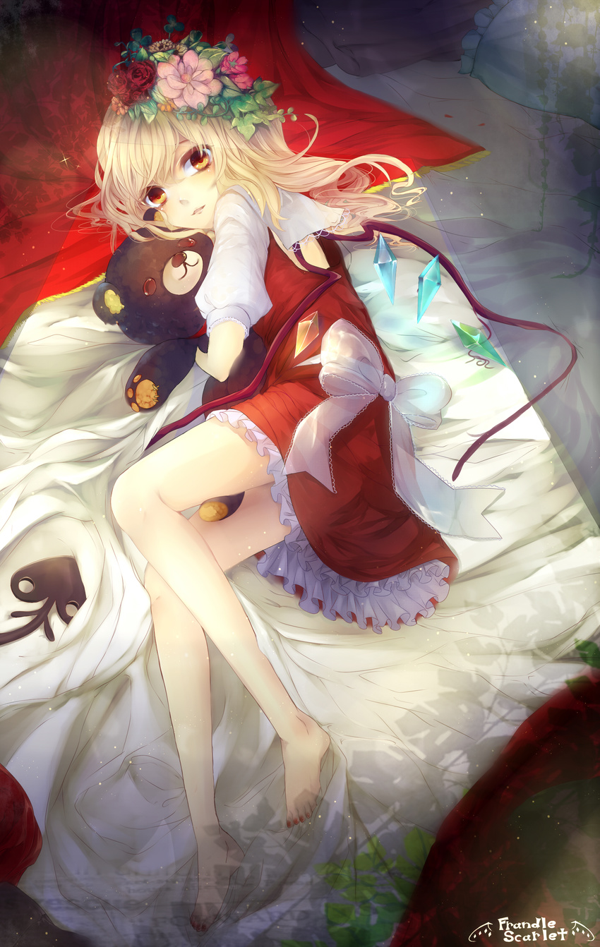 absurdres bad_id bad_pixiv_id barefoot bed blanket daimaou_ruaeru doll_hug dress flandre_scarlet flower hair_flower hair_ornament highres juliet_sleeves laevatein light_particles long_sleeves looking_at_viewer lying nail_polish on_bed on_side pillow puffy_sleeves red_dress red_nails sash solo stuffed_animal stuffed_toy teddy_bear thighs toenail_polish touhou wings yellow_eyes