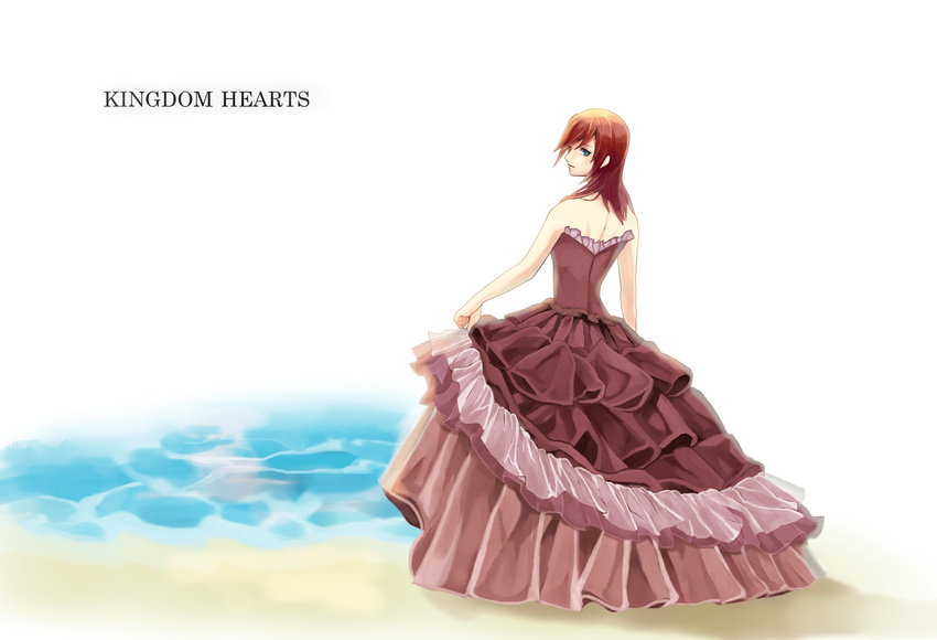 1girl beach blue_eyes copyright_name dress female highres kairi kingdom_hearts long_hair red_hair solo strapless_dress water