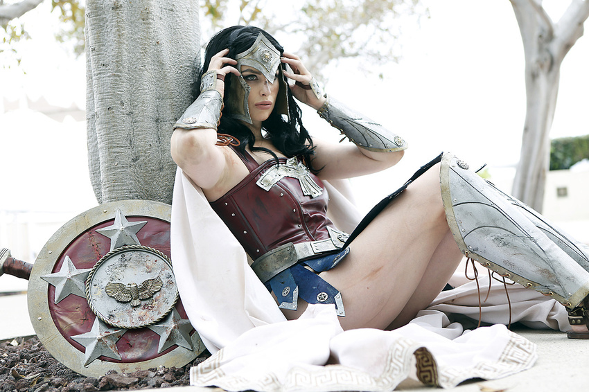1girl amazon armor blue_eyes cape cosplay dc_comics greaves meagan_marie photo pteruges shield sitting solo sword tiara vambraces wonder_woman wonder_woman_(cosplay) wonder_woman_(series)
