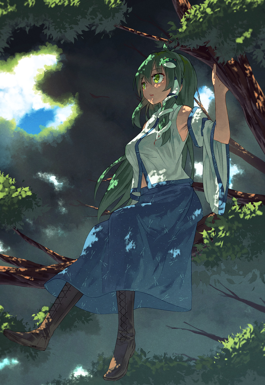arm_at_side blue_sky boots cloud cross-laced_footwear dappled_sunlight day detached_sleeves foot_dangle forest frog_hair_ornament green_eyes green_hair hair_ornament hand_up highres ibuki_notsu in_tree kochiya_sanae long_hair looking_away nature outdoors sitting skirt sky snake_hair_ornament solo sunlight touhou tree wide_sleeves