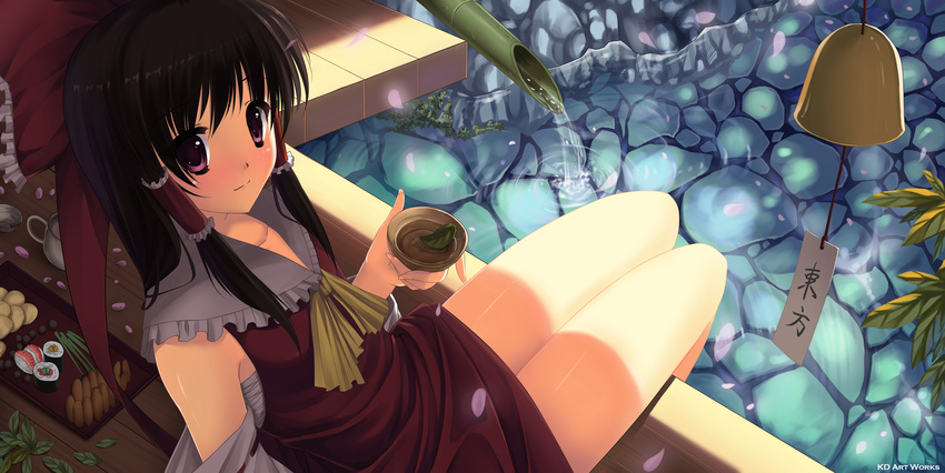 ascot bell black_hair bow caidychen cup detached_sleeves food from_above hair_bow hair_tubes hakurei_reimu highres legs looking_at_viewer makizushi nigirizushi purple_eyes sitting smile soaking_feet solo sushi tea touhou water