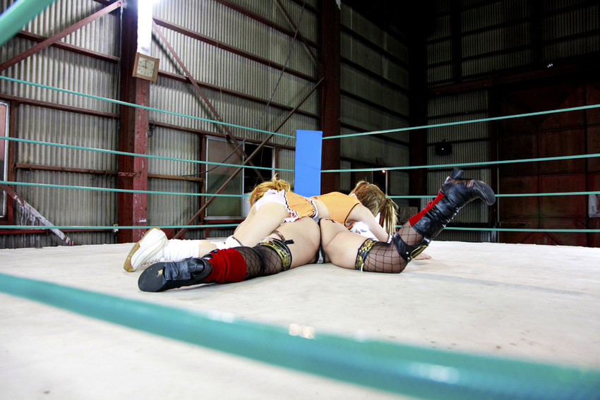 arena ass blonde_hair boxing_ring breasts brown_hair chouzuki_maryou cleavage cosplay eyepatch fingerless_gloves gloves huge_ass mistress_spencer mistress_spencer_(cosplay) multiple_girls photo rebecca_welsh rebecca_welsh_(cosplay) rumble_roses rumble_roses_xx suzuka_itsuki whip