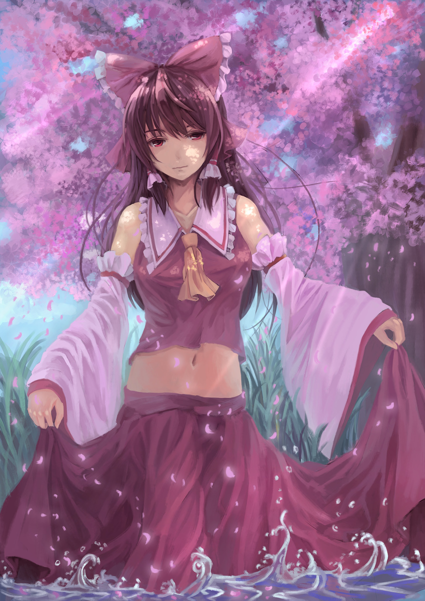bow breasts brown_hair cherry_blossoms collarbone dappled_sunlight detached_sleeves expressionless hair_bow hair_tubes hakurei_reimu highres light_rays long_hair looking_at_viewer medium_breasts midriff navel outdoors petals red_eyes skirt skirt_hold skirt_set solo splashing sunlight touhou tree wading water youxuemingdie