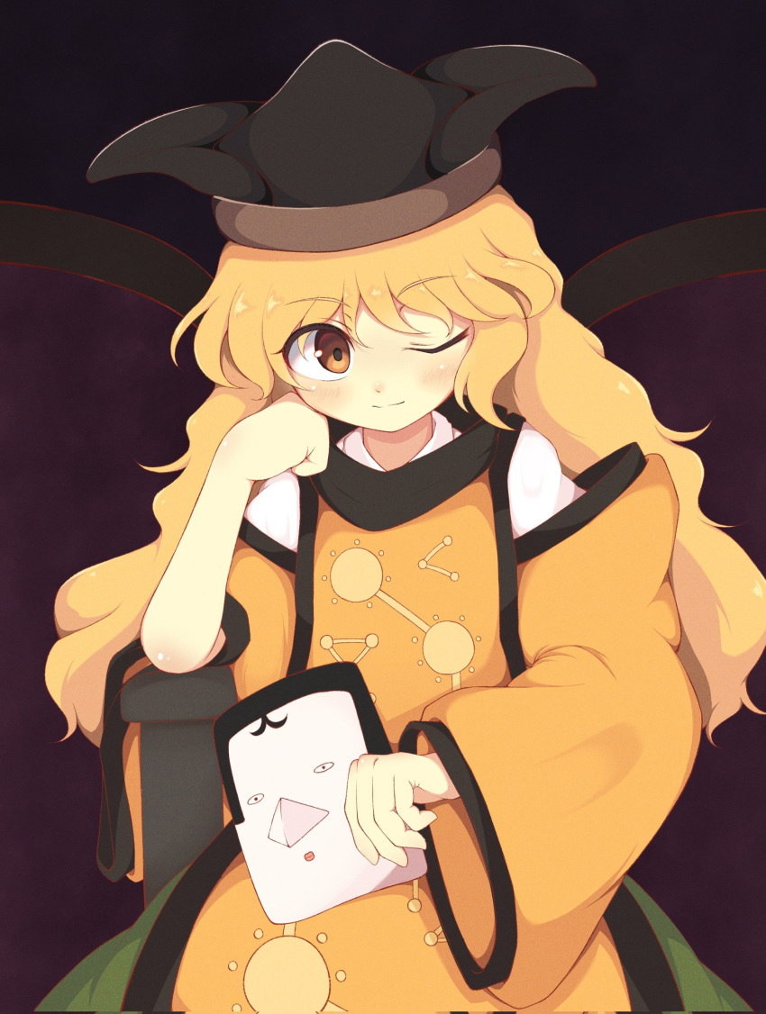 1girl black_hat blonde_hair blush brown_background brown_eyes brown_hat cape chair closed_mouth commentary_request constellation constellation_print detached_sleeves eyes_visible_through_hair green_skirt hair_between_eyes hand_on_own_face hand_up hat highres iyo_mamoru long_hair long_sleeves looking_at_viewer mask matara_okina one_eye_closed orange_cape shirt simple_background sitting skirt smile solo tabard textless_version touhou wavy_hair white_shirt wide_sleeves