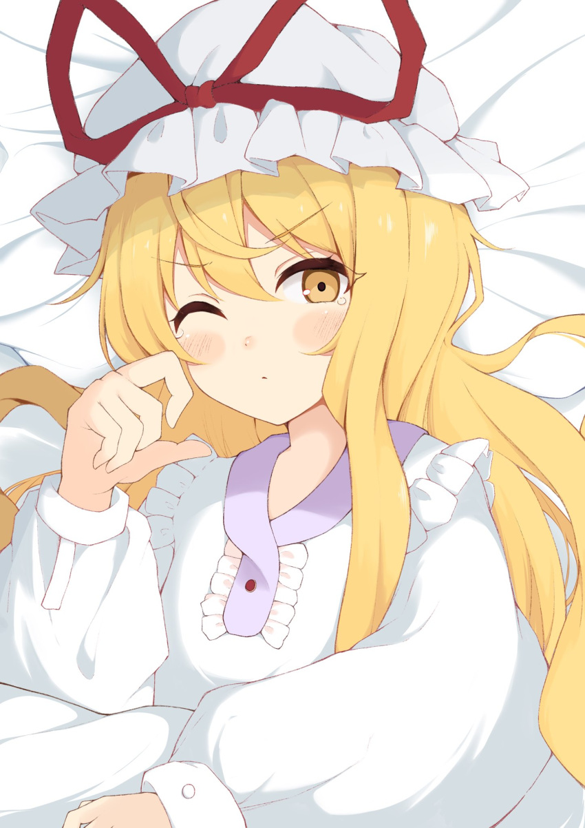 1girl bed_sheet blonde_hair collared_dress commentary_request dress frills hat hat_ribbon highres iyo_mamoru long_hair long_sleeves lying mob_cap on_back one_eye_closed puffy_sleeves red_ribbon ribbon rubbing_eyes sidelocks solo touhou v-shaped_eyebrows very_long_hair white_dress white_hat yakumo_yukari yellow_eyes