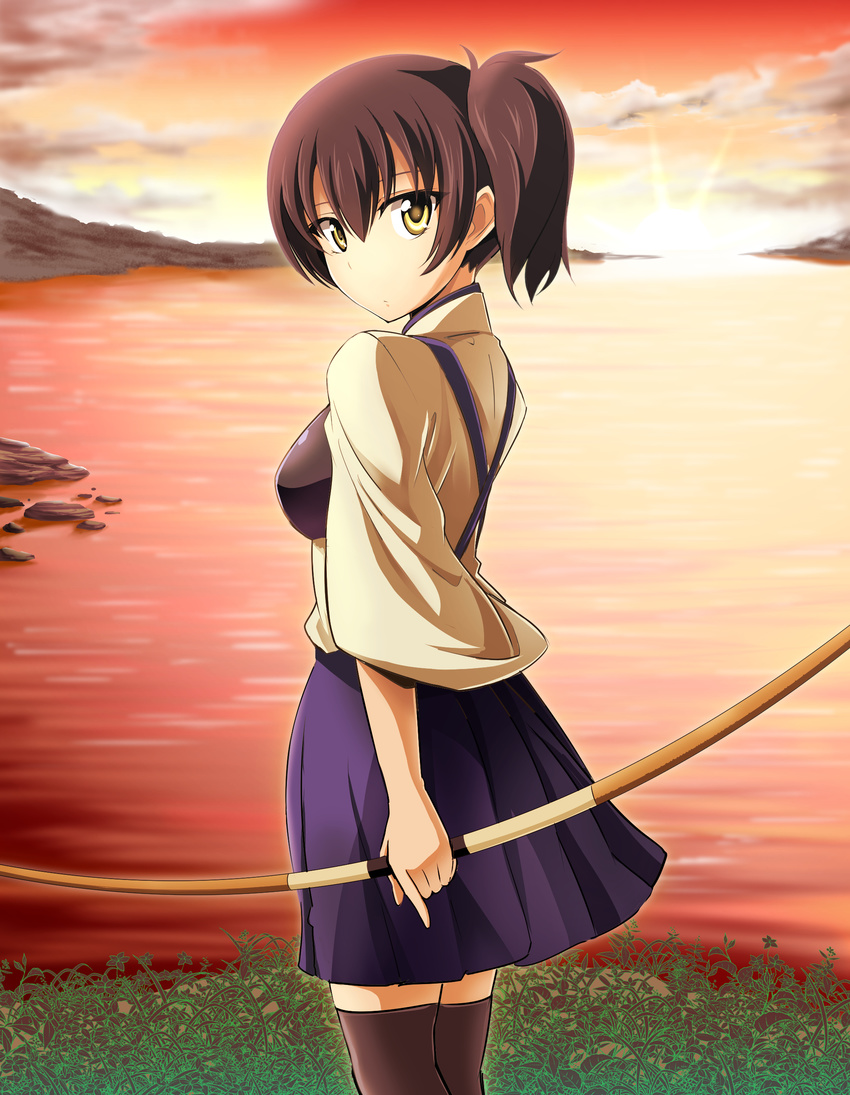 absurdres bay black_legwear bow_(weapon) breasts brown_hair cloud cowboy_shot from_side grass hakama_skirt highres index_finger_raised japanese_clothes kaga_(kantai_collection) kantai_collection kayama_kenji looking_at_viewer looking_to_the_side muneate ocean orange_sky outdoors shore side_ponytail sky small_breasts solo sun sunset thighhighs water weapon yellow_eyes zettai_ryouiki