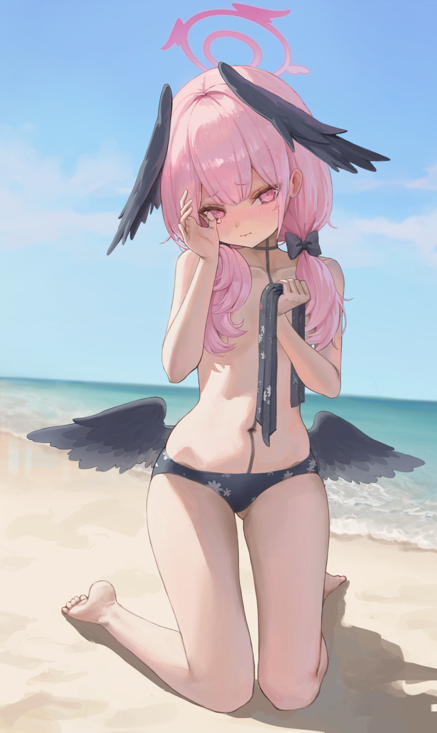 1girl absurdres ass_visible_through_thighs bare_shoulders barefoot beach bikini black_bikini black_wings blue_archive blue_sky blush body_markings closed_mouth cloud crying crying_with_eyes_open feathered_wings floral_print halo head_wings highres holding holding_clothes holding_swimsuit koharu_(blue_archive) koharu_(swimsuit)_(blue_archive) long_hair low_twintails low_wings mini_wings outdoors p00nipooni pink_eyes pink_hair pink_halo print_bikini sand sky solo swimsuit tears toes twintails unworn_bikini_top water wings wiping_tears