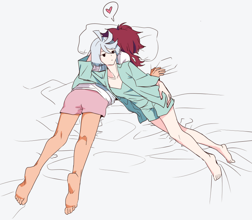 2girls bare_legs barefoot closed_mouth commentary green_shirt green_shorts grey_background gundam gundam_suisei_no_majo heart highres long_hair looking_at_viewer lying lying_on_person miorine_rembran multiple_girls on_bed on_stomach pajamas pillow pink_shorts princess_(ye8787859) red_hair shirt shorts simple_background spoken_heart suletta_mercury white_hair white_shirt