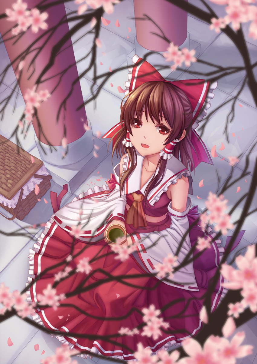 ascot blurry brown_hair cherry_blossoms cup depth_of_field detached_sleeves from_above hair_ornament hair_ribbon hair_tubes hakurei_reimu highres japanese_clothes long_skirt long_sleeves looking_at_viewer miko open_mouth petals red_eyes red_skirt ribbon shirt short_hair skirt skirt_set smile solo teacup touhou wide_sleeves youxuemingdie