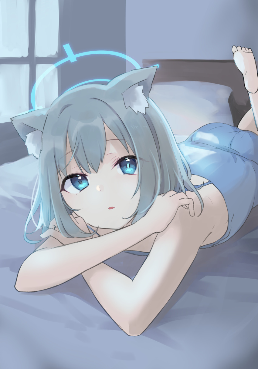 1girl animal_ear_fluff animal_ears bare_arms bare_shoulders barefoot bed blue_archive blue_camisole blue_eyes camisole commentary_request crossed_arms grey_hair gucchiann halo highres long_hair looking_at_viewer lying on_bed on_stomach parted_lips pillow shiroko_(blue_archive) soles solo window