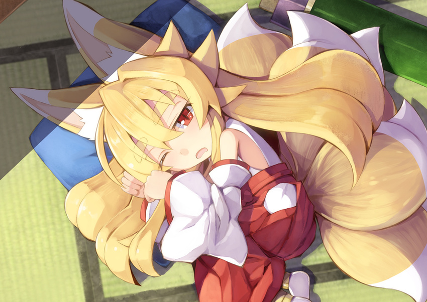 animal_ears bare_shoulders chibi curled_up detached_sleeves eyebrows eyebrows_visible_through_hair fox_ears fox_tail from_above hip_vent izuna_(shinrabanshou) japanese_clothes kyuubi long_hair looking_at_viewer lying miko multiple_tails on_side one_eye_closed open_mouth pillow red_eyes saru_000 shinrabanshou sleepy solo tail thick_eyebrows younger