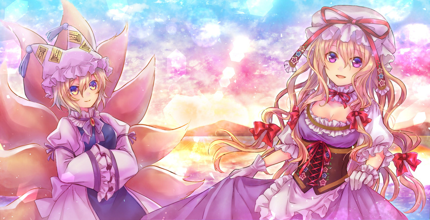 2girls animal_ears blonde_hair bow breasts cleavage dress foxgirl gloves hat long_hair multiple_tails neme short_hair sunset tail touhou yakumo_ran yakumo_yukari