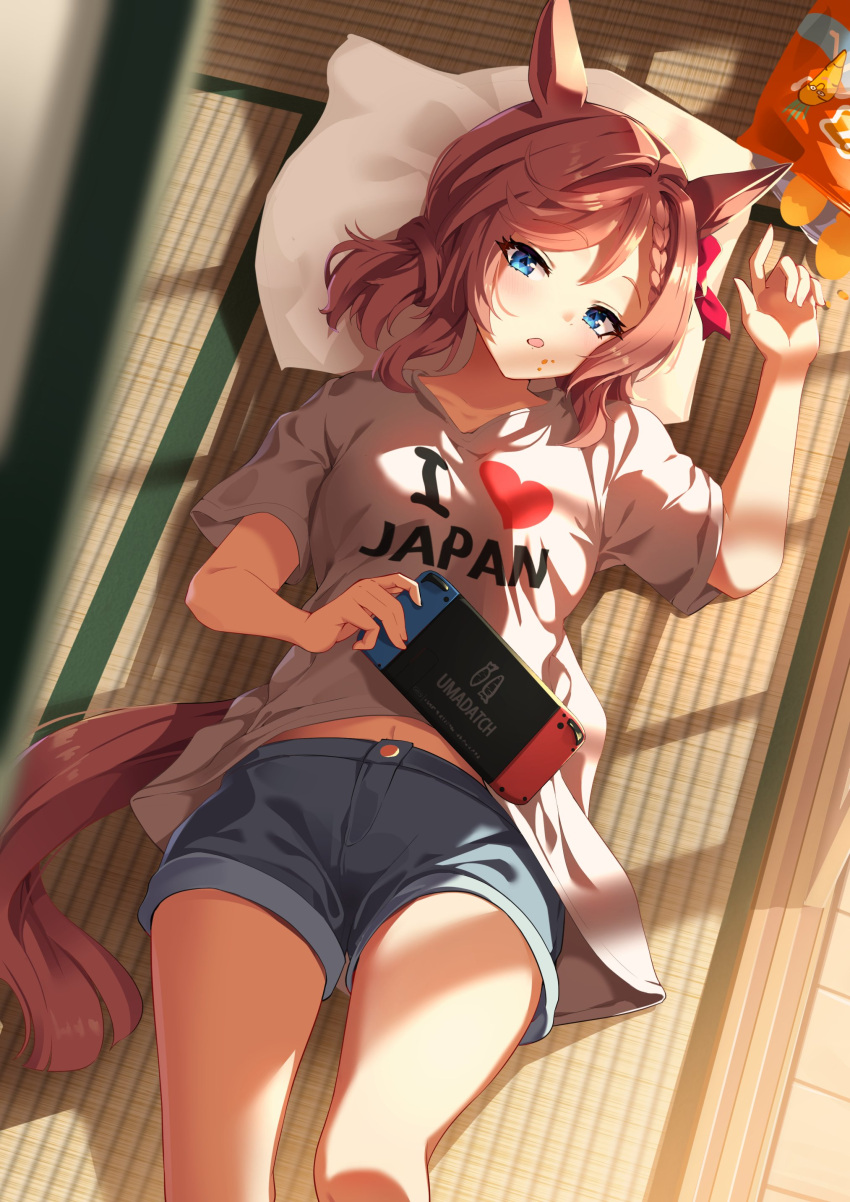 1girl absurdres animal_ears blue_eyes bow braid brown_hair collarbone crumbs hair_between_eyes highres horse_ears horse_girl horse_tail looking_at_viewer lying navel nintendo_switch open_mouth pillow shirt shorts solo sunny_(20597521) tail tatami umamusume venus_park_(umamusume) white_shirt