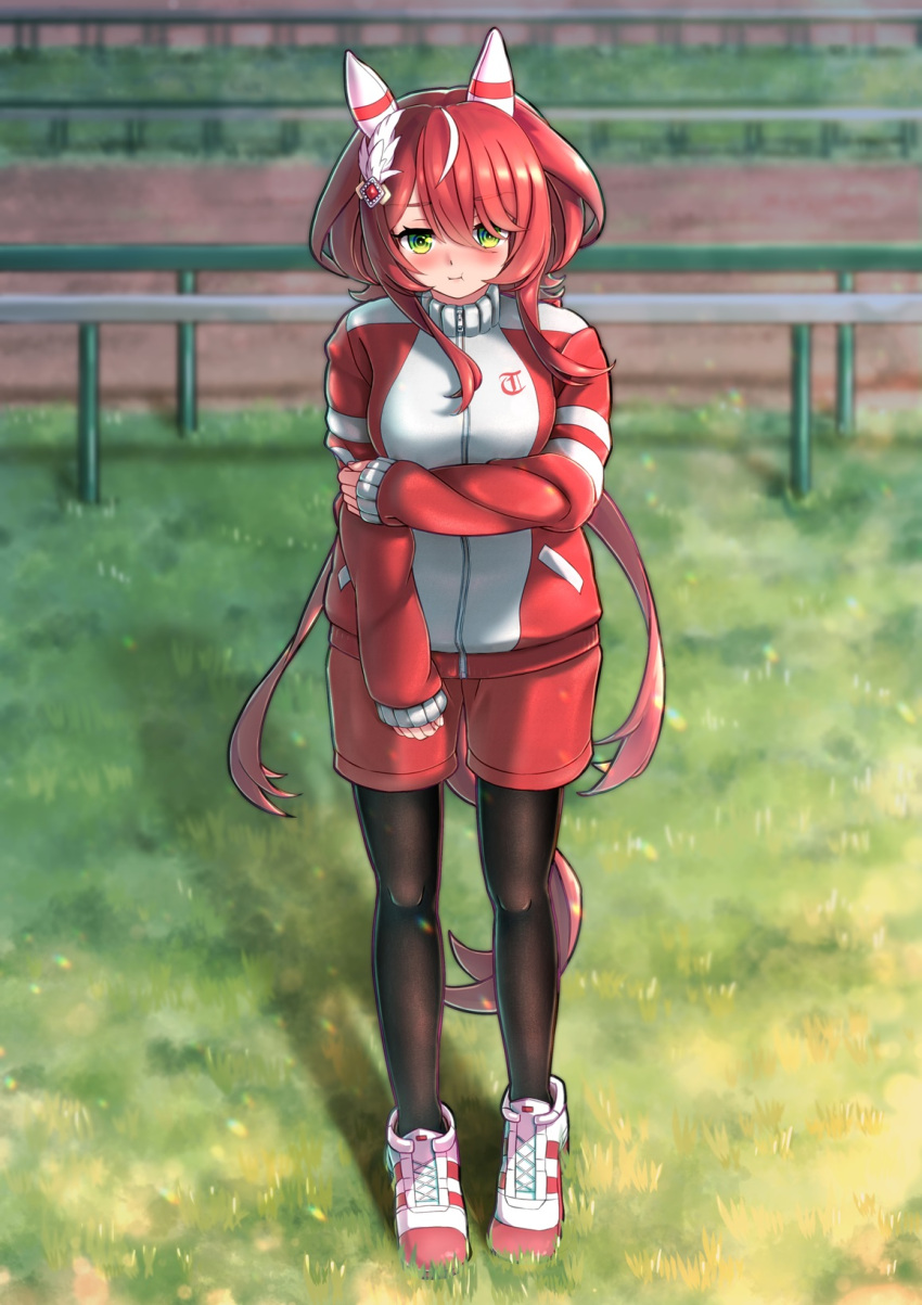 1girl animal_ears blurry blurry_background closed_mouth commentary_request fence full_body grass green_eyes hair_between_eyes hair_ornament highres horse_ears horse_girl horse_tail jacket long_hair looking_at_viewer low_twintails noshiro_pixv pantyhose pout red_hair shoes shorts solo standing tail track_jacket twintails umamusume win_variation_(umamusume)