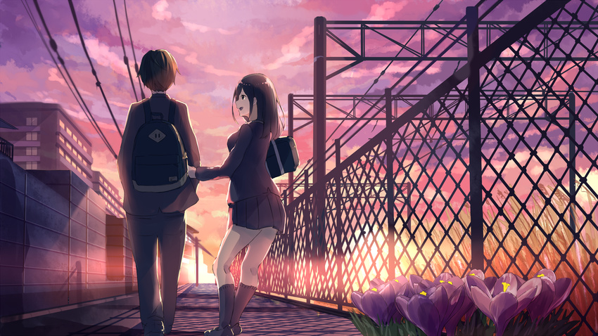 1girl :d akira_(mr_akira) arm_holding back backpack bag black_footwear black_hair black_pants blazer building chain-link_fence cloud crocus_(flower) fence flower from_behind grass hand_on_another's_arm hands_in_pockets highres jacket kneehighs lens_flare loafers long_hair long_sleeves miniskirt open_mouth original outdoors pants pleated_skirt power_lines purple_flower school_bag school_uniform shade shadow shoes shoulder_bag skirt sky smile sunset utility_pole vocaloid walking wall