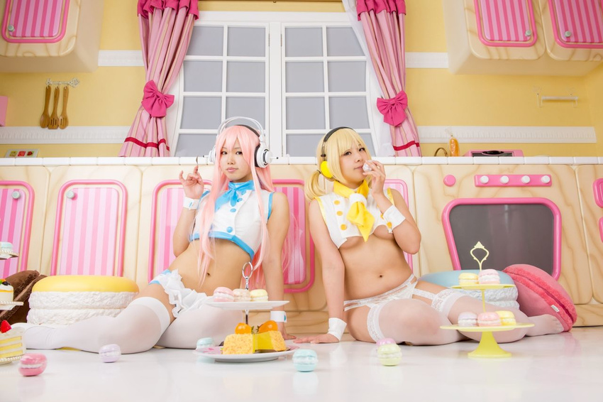 blonde_hair blush brown_eyes cake cosplay crop_top food frilled_skirt frills garter_belt headphones long_hair looking_at_viewer macaron mascot multiple_girls navel necktie nitroplus panties photo pink_hair plump sitting stockings super_pochaco super_pochaco_(cosplay) super_sonico super_sonico_(cosplay) tatsuki thighhighs twintails white_panties yusu_(coplayer)