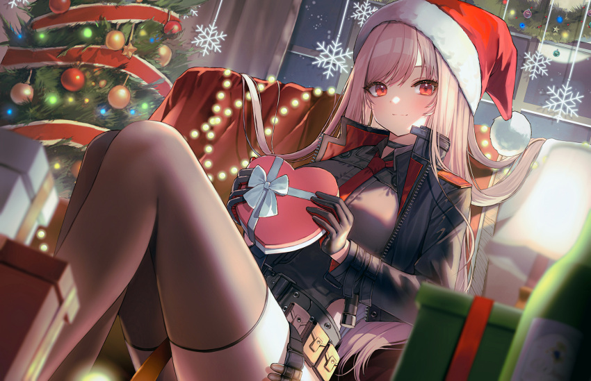 1girl belt belt_pouch black_gloves black_jacket black_shirt black_thighhighs blurry box breasts brown_hair christmas christmas_tree closed_mouth commentary_request depth_of_field desk_lamp gift gift_box gloves goddess_of_victory:_nikke hanato_(seonoaiko) hat heart-shaped_box highres holding holding_gift indoors jacket knees_up korean_commentary lamp long_sleeves looking_at_viewer necktie open_clothes open_jacket pouch rapi_(nikke) red_eyes red_headwear red_necktie santa_hat shirt smile snowflake_print solo thighhighs thighs utility_belt