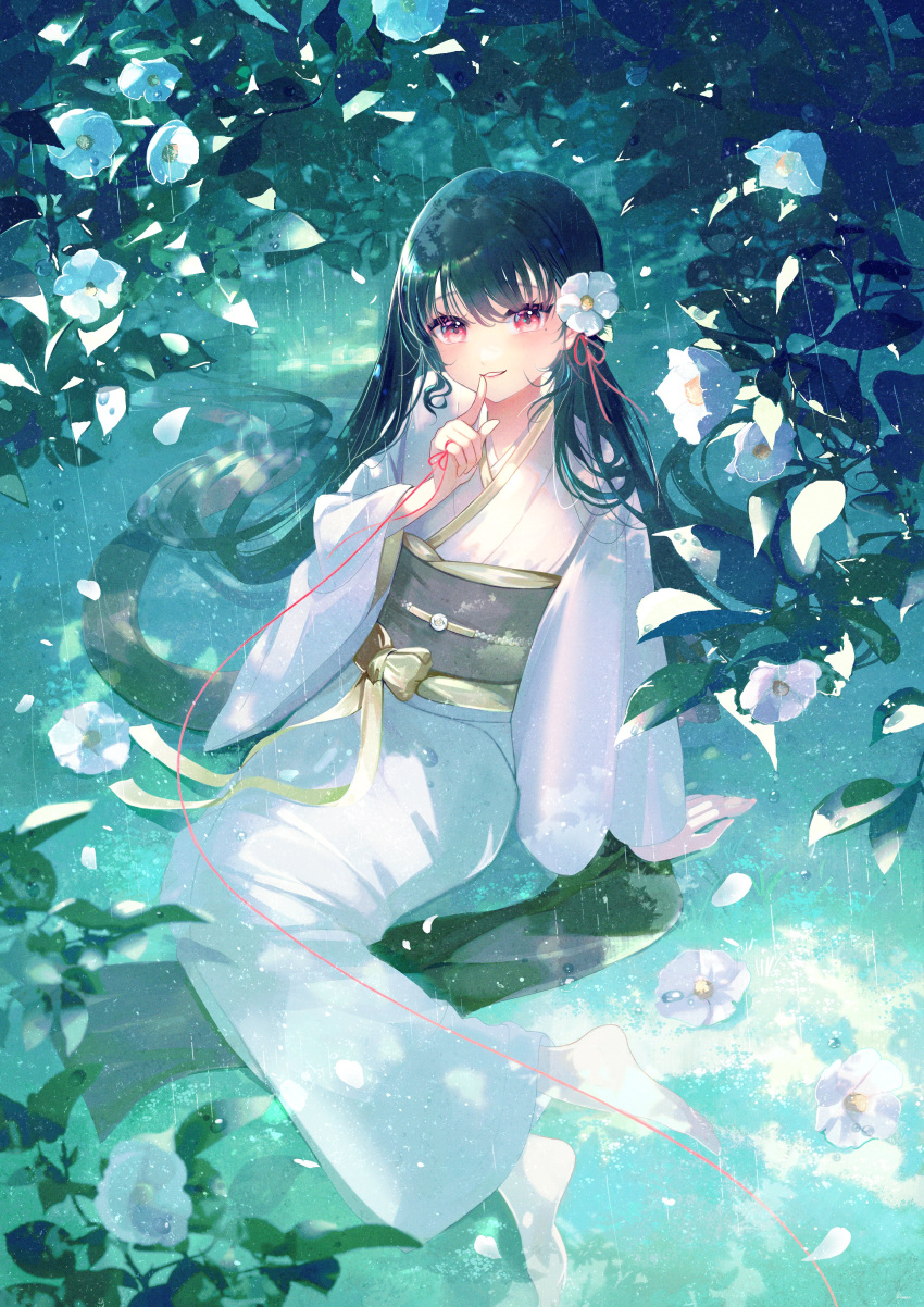 1girl absurdres arm_support barefoot black_hair blurry camellia depth_of_field finger_to_mouth flower green_hair hair_flower hair_ornament hand_up highres index_finger_raised japanese_clothes kimono long_hair long_sleeves looking_at_viewer mole mole_under_eye nature obi on_ground original petals rain red_eyes sash shushing sitting smile solo string string_of_fate toumin_(onemunemu99) very_long_hair white_footwear white_kimono yokozuwari