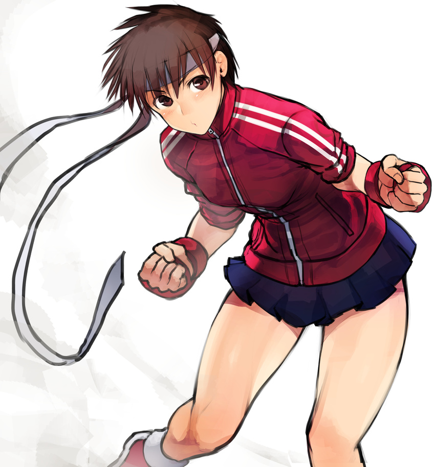 arm_guards bangs blue_skirt blush breasts brown_eyes brown_hair clenched_hands double_vertical_stripe gloves headband high_collar highres jacket kasugano_sakura leaning_forward legs_apart long_sleeves looking_at_viewer medium_breasts miniskirt nishiide_kengorou pleated_skirt pouty_lips red_jacket short_hair simple_background skirt sleeves_pushed_up solo street_fighter striped tareme thighs track_jacket vertical_stripes white_background zipper