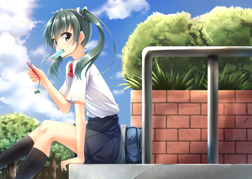 alternate_costume arm_at_side bag black_legwear blue_skirt blue_sky blush bow bowtie brick_wall brown_eyes bush cellphone charm_(object) cloud commentary contemporary day eyebrows eyebrows_visible_through_hair food forest from_side green_hair hair_ribbon hino_(2nd_life) holding holding_phone kantai_collection kneehighs looking_at_viewer looking_to_the_side miniskirt mouth_hold nature outdoors phone plant pleated_skirt popsicle railing red_bow red_neckwear ribbon school_bag shirt short_sleeves sitting skirt sky smartphone solo tareme tree twintails white_ribbon white_shirt zuikaku_(kantai_collection)