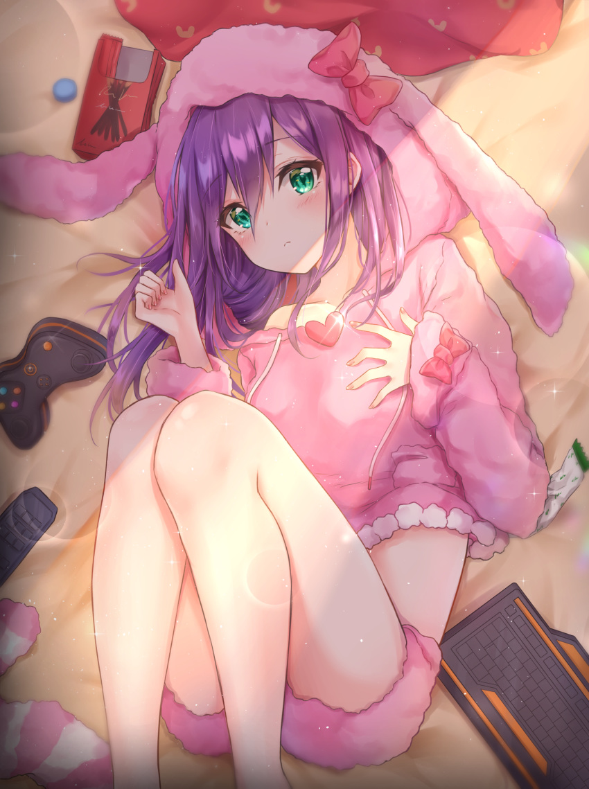 1girl animal_ears animal_hood bangs bare_legs bare_shoulders bed_sheet blurry blush brooch closed_mouth collarbone commentary_request controller cuna_(qunya) depth_of_field drawstring eyebrows_visible_through_hair fake_animal_ears feet_out_of_frame floppy_ears food game_controller glint green_eyes hair_between_eyes hand_up heart highres hood hooded_sweater idolmaster idolmaster_million_live! jewelry keyboard_(computer) knees_up light light_particles long_hair long_sleeves looking_at_viewer lying midriff mochizuki_anna nail_polish off_shoulder on_back on_bed pink_nails pink_shorts pink_sweater pocky purple_hair short_shorts shorts sidelocks sleeves_past_wrists solo sweater thighs