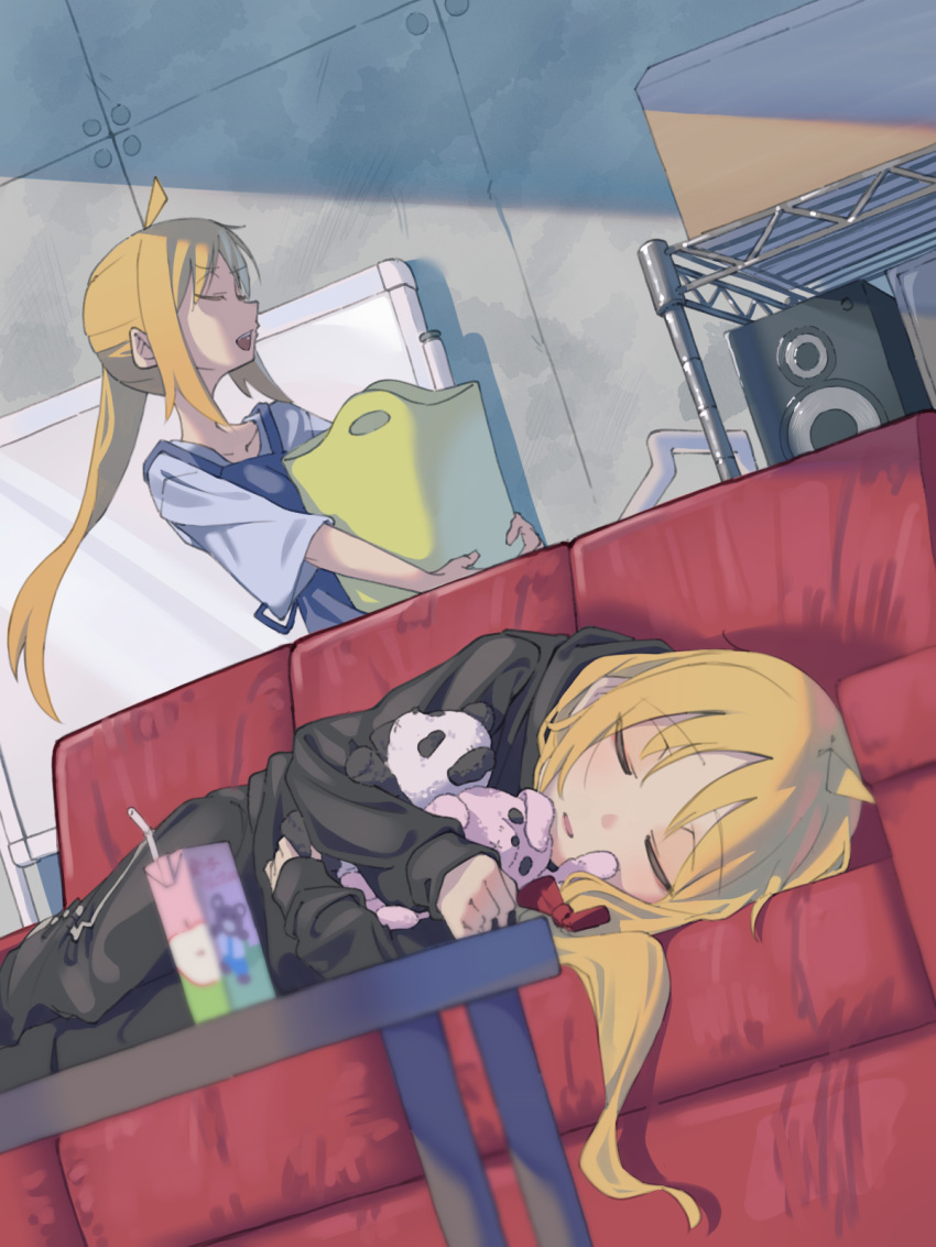 2girls ahoge arisaki_(cnxy7525) black_hoodie black_pants blonde_hair blurry blurry_foreground bocchi_the_rock! closed_eyes couch grey_shirt highres hood hoodie hugging_doll hugging_object ijichi_nijika ijichi_seika indoors juice_box laundry_basket long_hair long_sleeves lying multiple_girls on_side open_mouth overalls pants ponytail shelf shirt sidelocks sleeping speaker stuffed_animal stuffed_rabbit stuffed_toy table teddy_bear walking whiteboard