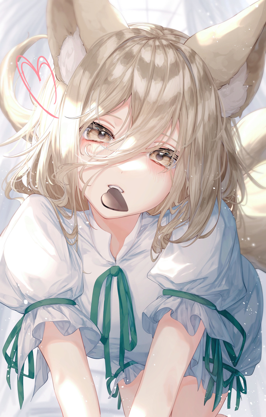 1girl absurdres animal_ears blonde_hair candy chocolate food fox_ears fox_tail green_ribbon heart heart-shaped_chocolate highres kudamaki_tsukasa looking_at_viewer ribbon romper short_hair short_sleeves solo tail toku_kekakewanko touhou white_romper yellow_eyes