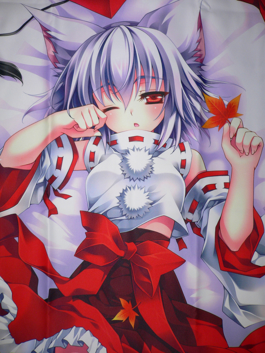 absurdres animal_ears bare_shoulders bed detached_sleeves highres inubashiri_momiji leaf lying maple_leaf on_back one_eye_closed riv solo touhou waking_up wolf_ears